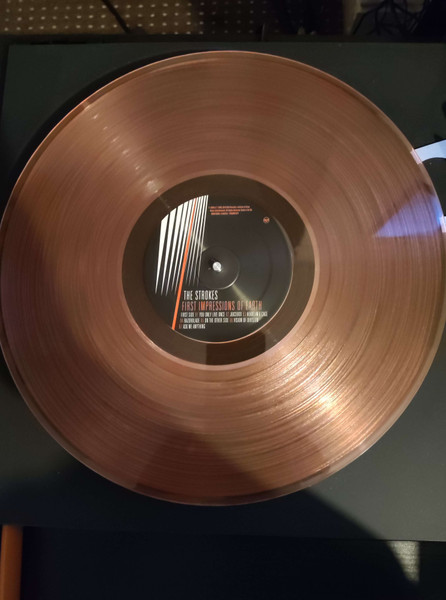 STROKES – FIRST IMPRESSIONS OF EARTH hazy red vinyl LP